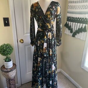 Black floral maxi dress with tie closure,perfect for a wedding or any occasion.